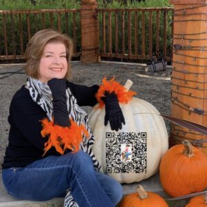 Jane Sauders with QR Code for LinkTree.